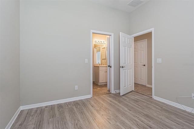 unfurnished bedroom featuring light wood-type flooring