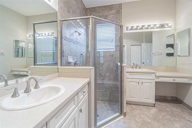 bathroom with vanity and an enclosed shower