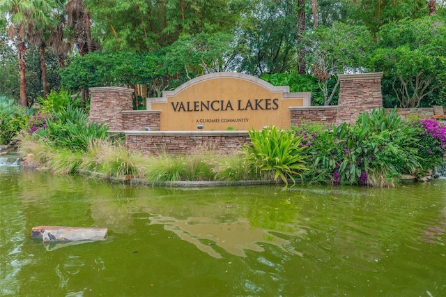 community sign with a water view