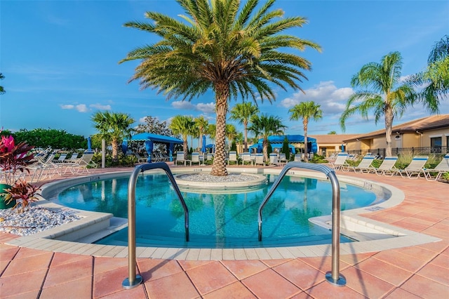 view of swimming pool featuring a patio area