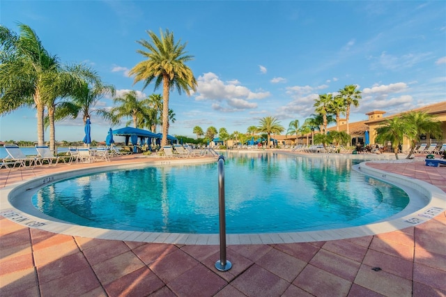 view of pool with a water view