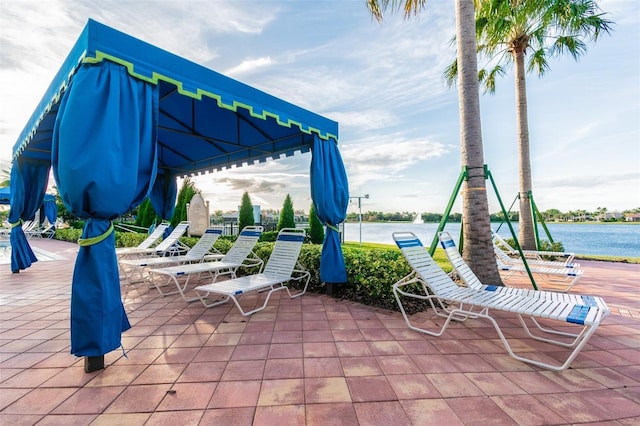 view of patio with a water view