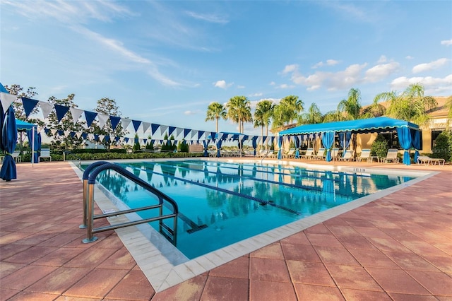 view of swimming pool with a patio area