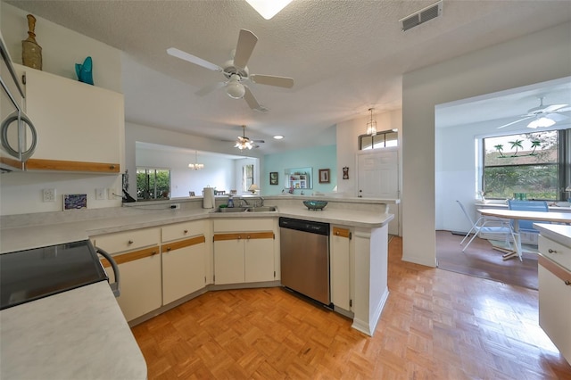 kitchen featuring stainless steel dishwasher, kitchen peninsula, sink, and light parquet floors