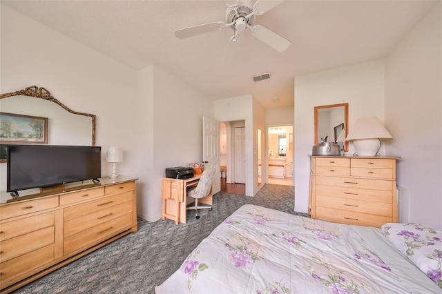 carpeted bedroom featuring connected bathroom and ceiling fan