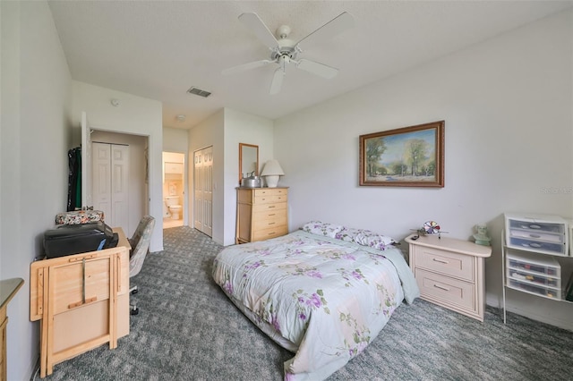 carpeted bedroom featuring ceiling fan, a closet, and ensuite bathroom