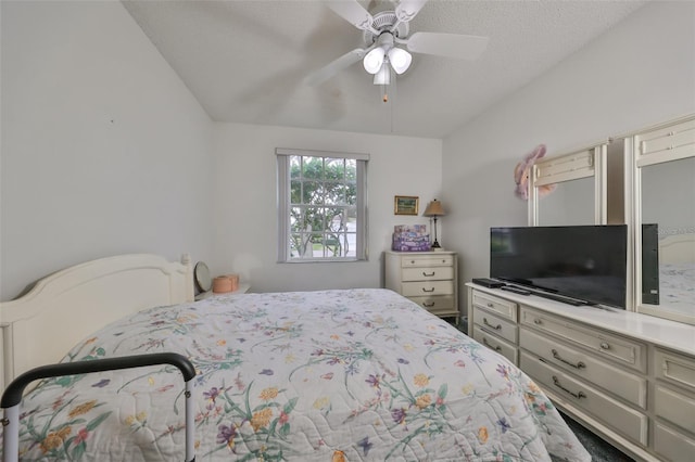 bedroom with ceiling fan, a textured ceiling, and vaulted ceiling