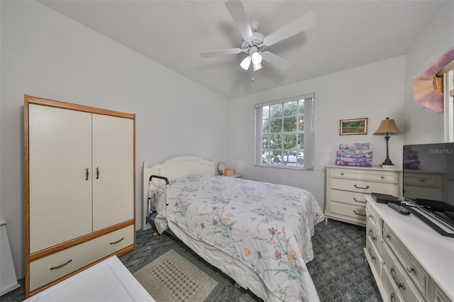 carpeted bedroom featuring a textured ceiling, a closet, and ceiling fan