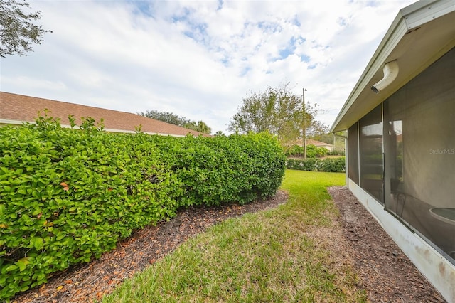 view of yard with a sunroom