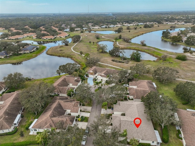 drone / aerial view with a water view