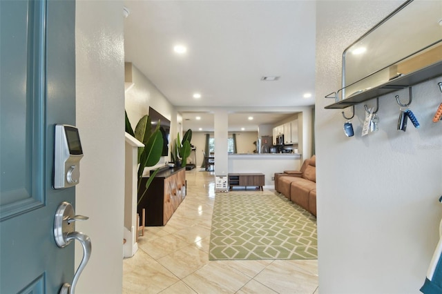 entrance foyer featuring light tile patterned flooring