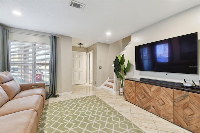 living room with light tile patterned floors