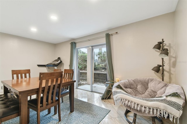 dining space featuring light tile patterned floors