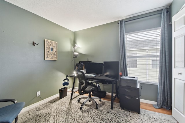 home office with wood-type flooring