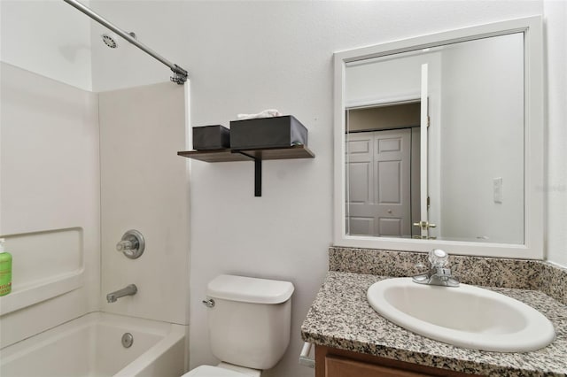 full bathroom featuring toilet, vanity, and washtub / shower combination