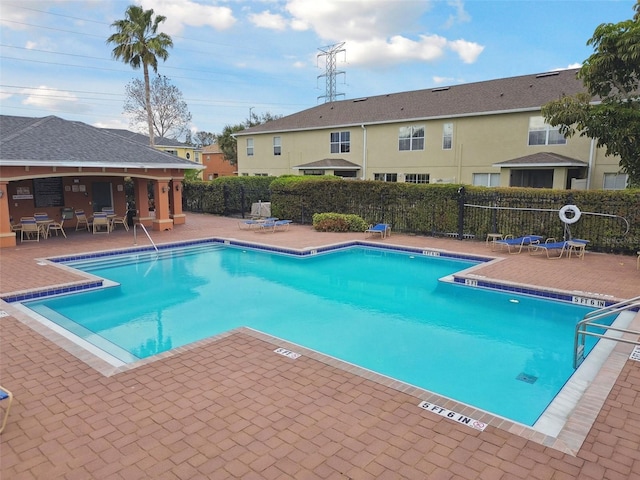 view of swimming pool featuring a patio area