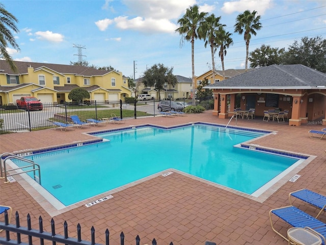 view of swimming pool featuring a gazebo and a patio