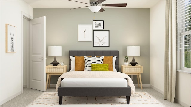 bedroom with ceiling fan and light colored carpet