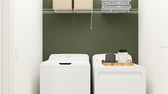 washroom with independent washer and dryer