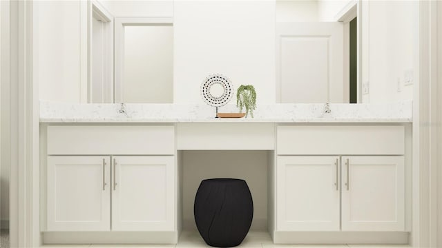 bathroom with tile patterned flooring and vanity