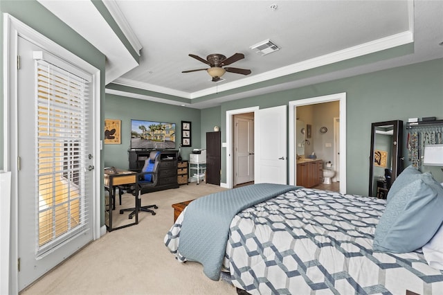 bedroom with a raised ceiling, multiple windows, ceiling fan, and light carpet