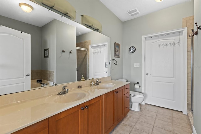 full bathroom featuring tile patterned flooring, vanity, toilet, and plus walk in shower