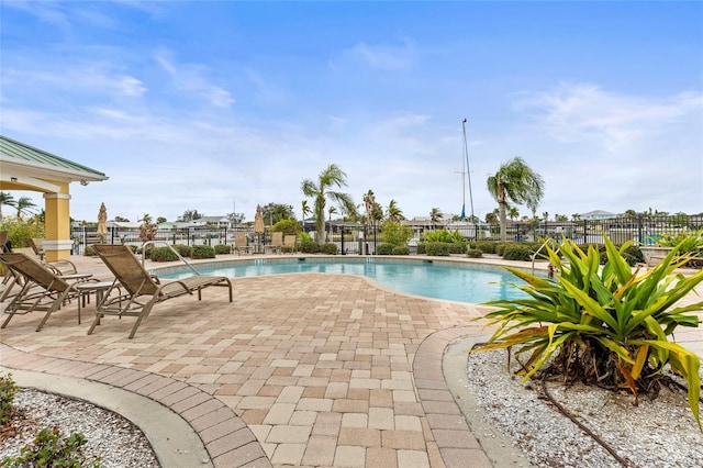 view of pool featuring a patio