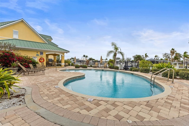 view of swimming pool with a patio area