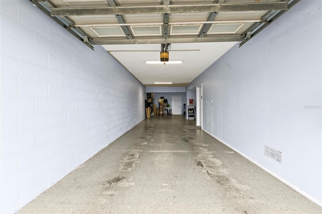 garage featuring a garage door opener