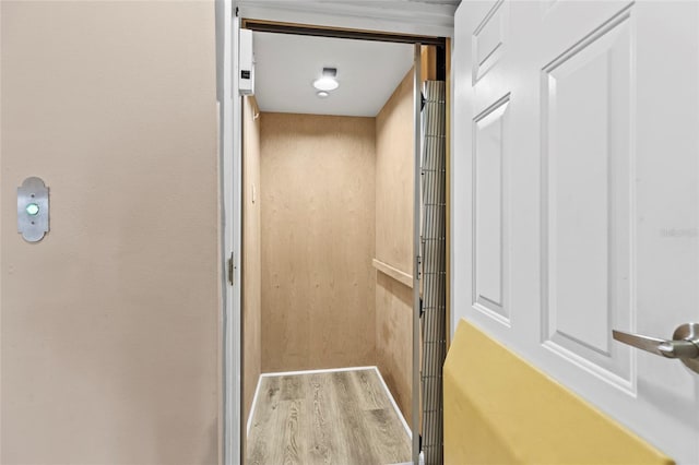 interior details with elevator and wood finished floors