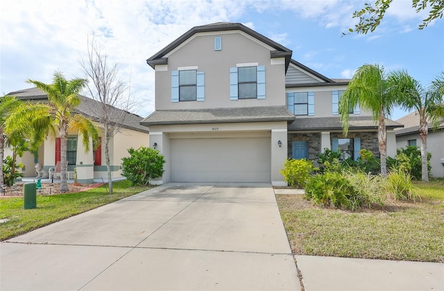 view of front of house with a garage and a front yard