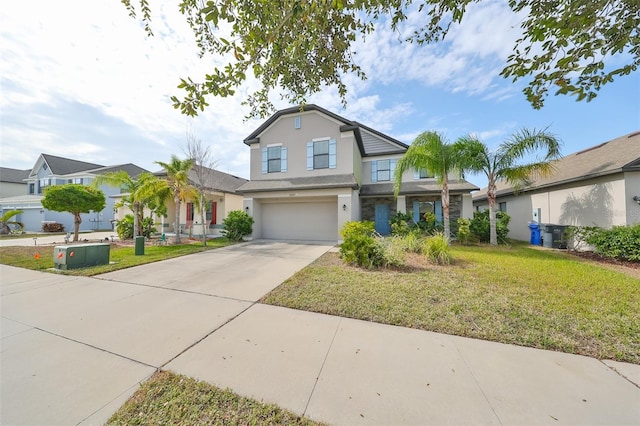 view of front of property with a garage and a front yard