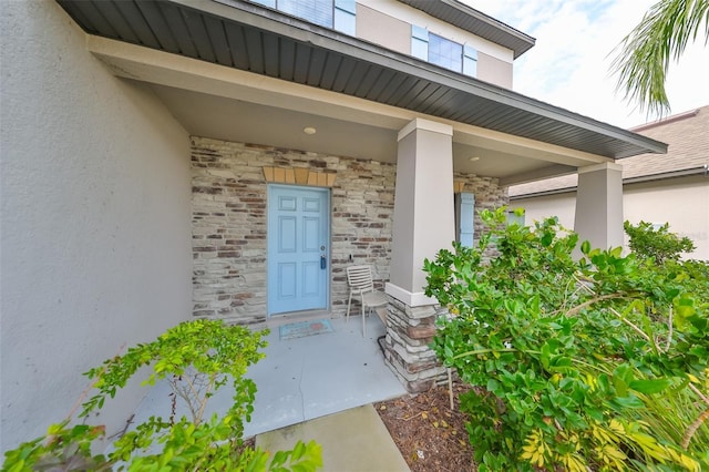 doorway to property featuring a porch