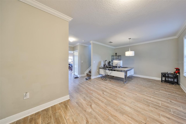 home office featuring light hardwood / wood-style floors, a textured ceiling, and ornamental molding