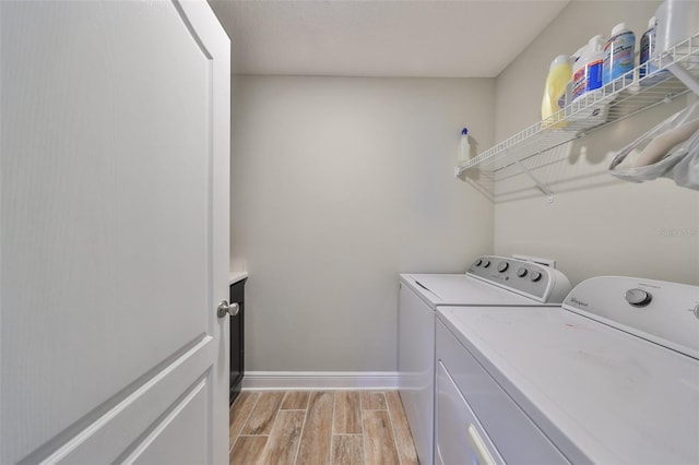 laundry area with washing machine and clothes dryer