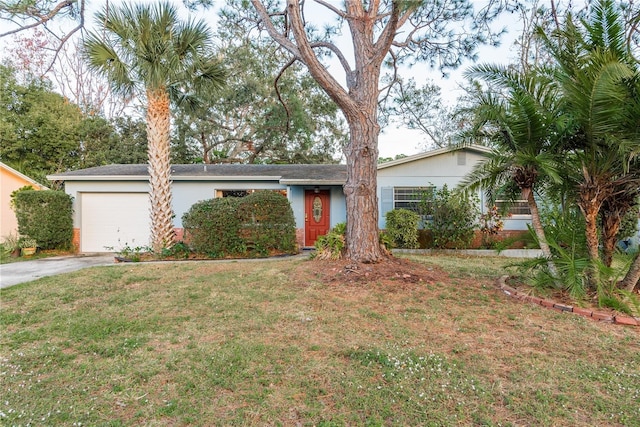 ranch-style house with a garage and a front yard