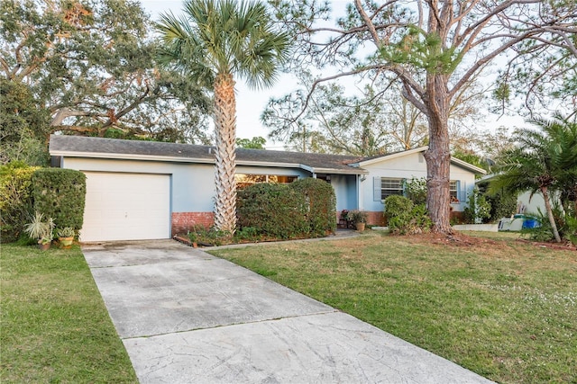 ranch-style home with a garage and a front lawn