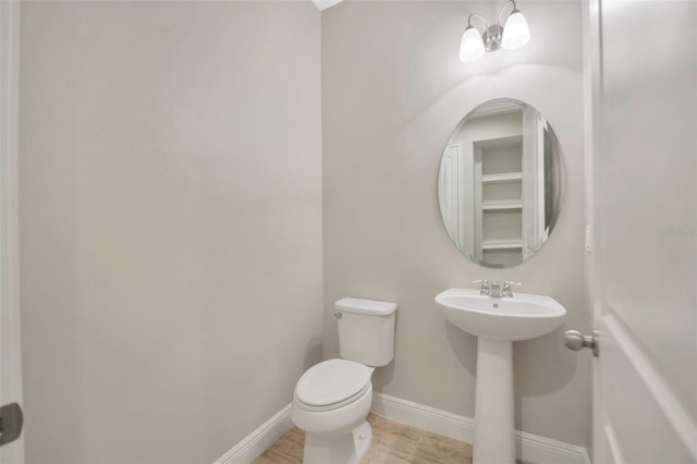 bathroom featuring toilet and sink