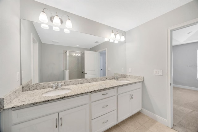 bathroom featuring vanity, tile patterned flooring, and walk in shower