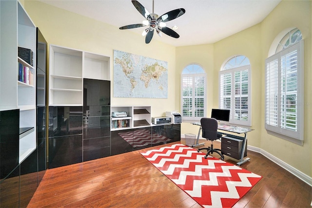 office space with ceiling fan and dark hardwood / wood-style floors