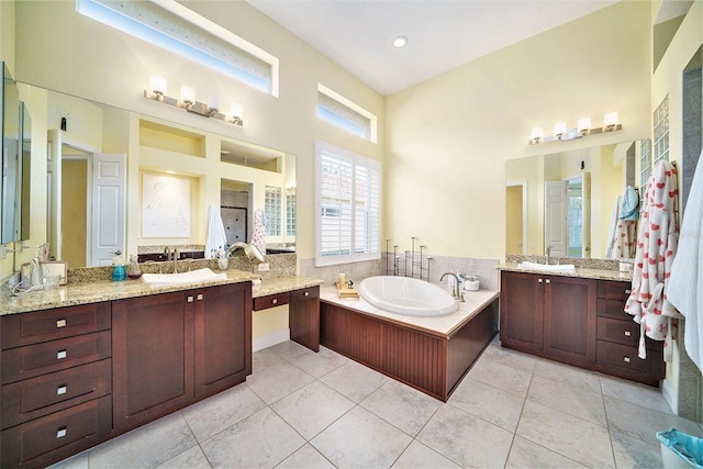 bathroom featuring vanity, separate shower and tub, and tile patterned flooring