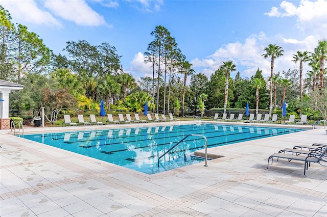 view of swimming pool with a patio