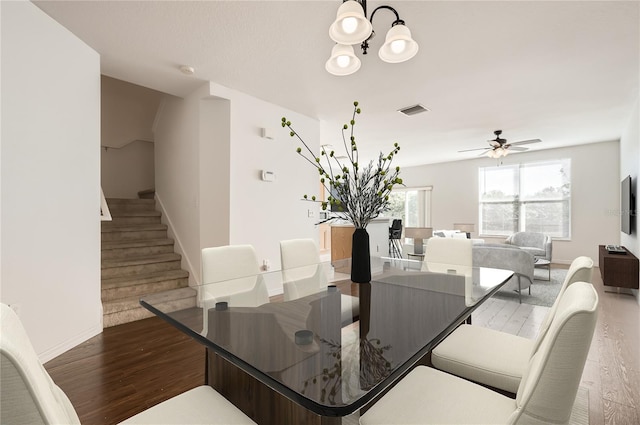 dining space featuring hardwood / wood-style flooring and ceiling fan