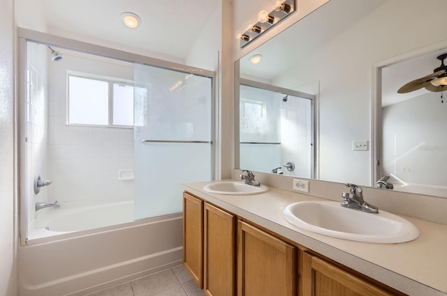 bathroom featuring tile patterned flooring, ceiling fan, enclosed tub / shower combo, and vanity