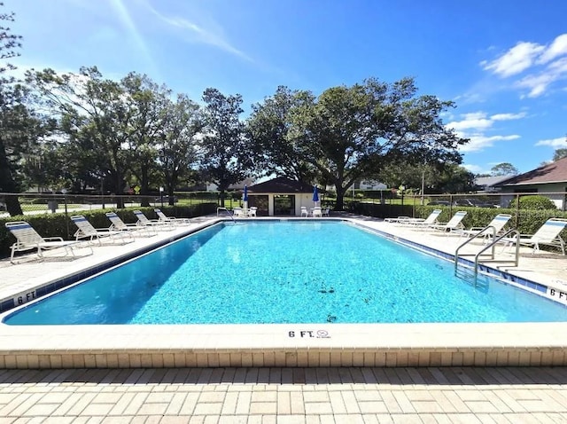 view of swimming pool with a patio area