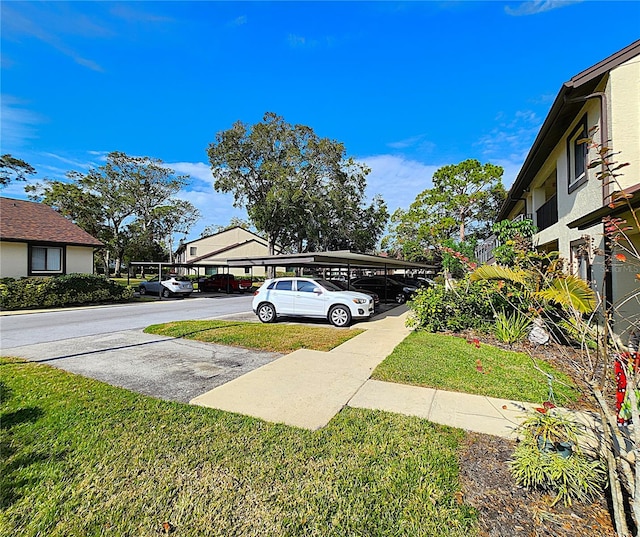 view of yard with a carport