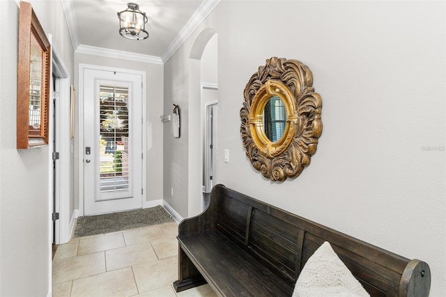 entryway featuring ornamental molding and light tile patterned floors