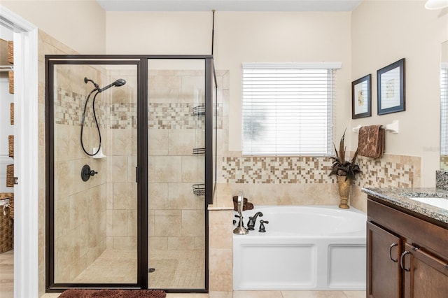 bathroom featuring vanity and plus walk in shower