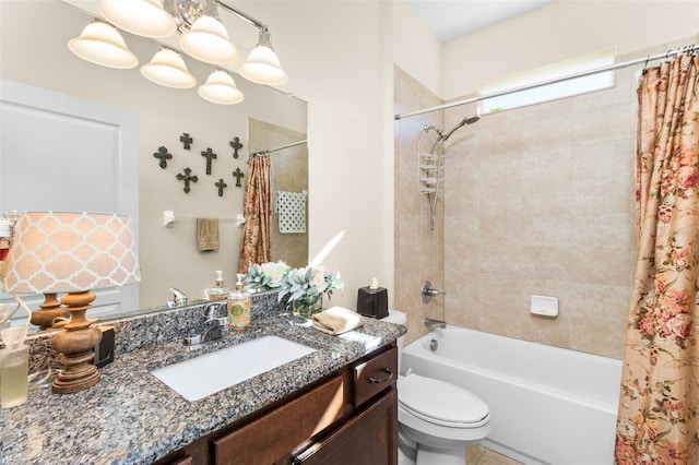 full bathroom featuring vanity, shower / tub combo, and toilet