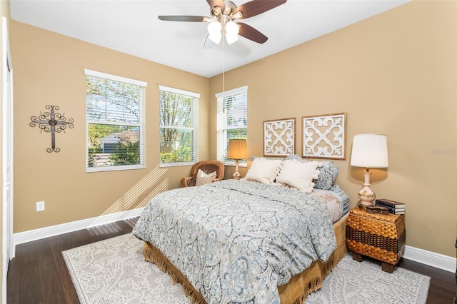 bedroom featuring dark hardwood / wood-style floors and ceiling fan